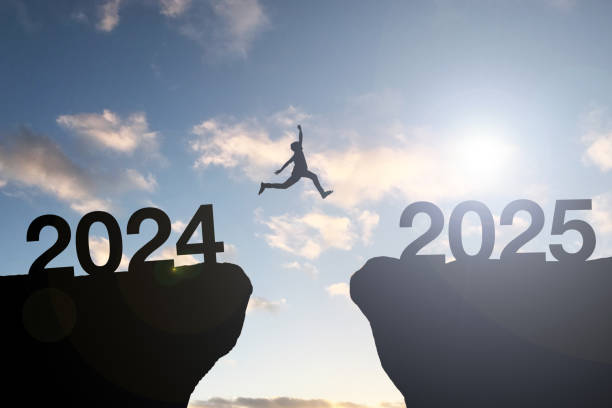 Silhouette of man is jumping from 2025 to 2025